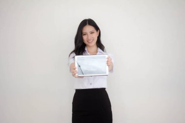 Portrait of thai adult student university uniform beautiful girl show her tablet.
