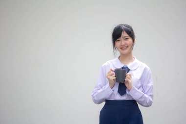 asia thai high school student uniform beautiful girl drinking hot drink