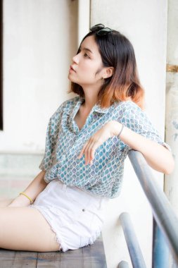 Portrait of thai adult beautiful girl short hair relax and smile