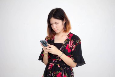 Portrait of thai adult beautiful girl short hair using her smart phone