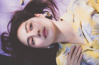 Portrait of thai yellow shirt adult beautiful girl relax time, in Vintage Style