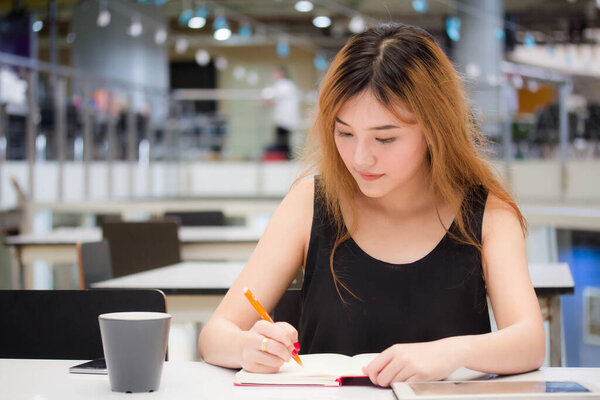 Beautiful young adult thai chinese bronze hair Write book