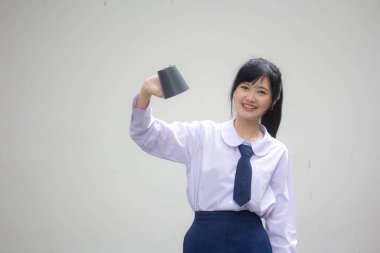 asia thai high school student uniform beautiful girl drinking hot drink