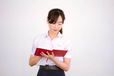 Asya Thai Lisesi üniformalı güzel kız. Bir kitap yaz.