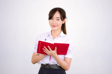 Asya Thai Lisesi üniformalı güzel kız. Bir kitap yaz.