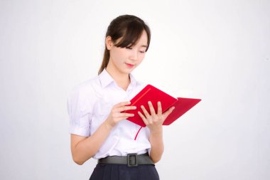 Asya Thai Lisesi üniformalı güzel kız. Bir kitap yaz.