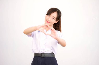 Taylandlı liseli üniformasının portresi. Genç güzel kız mutlu ve rahat.