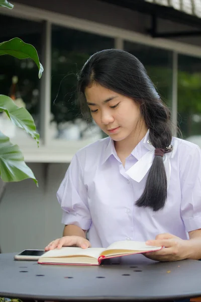 asia thai high school student uniform beautiful girl read a book