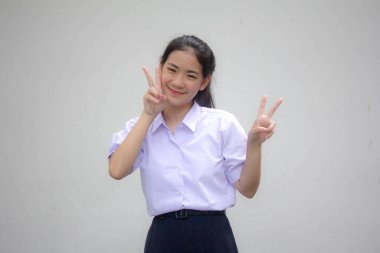 Taylandlı liseli üniformasının portresi Güzel kız zaferi