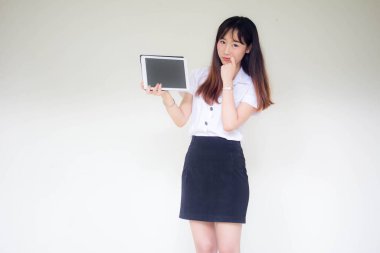 Portrait of thai adult student university uniform beautiful girl show her tablet.