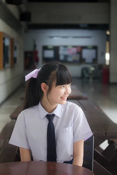 Portrait of thai Junior high school student uniform teen beautiful girl happy and relax