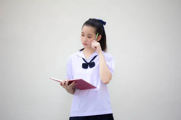 asia thai Junior high school student uniform beautiful girl Write a book