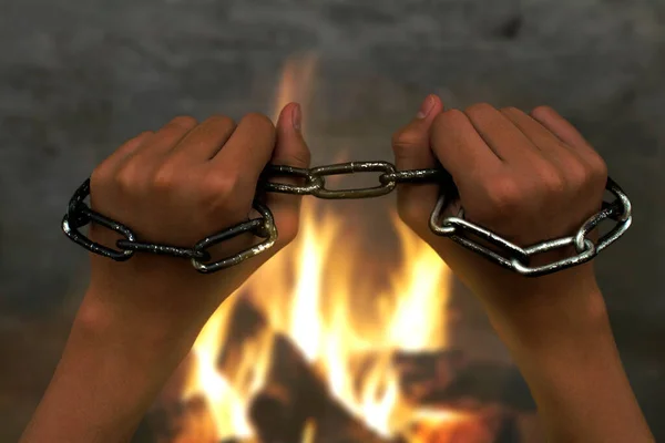 Siyah adamın elleri yanan ateşin üzerine zincirlenmiş..