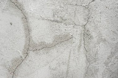 Arka plan için gri beton duvar dokusu. Beton duvardaki çatlaklar
