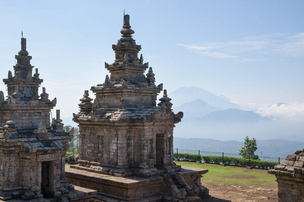 Candi Gedong Songo at sunrise. A 9th-century Buddhist temple complex on a volcano near Semarang, Java, Indonesia.