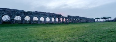 Ruins of Roman aqueduct Aqua Claudia in Parco degli Acquedotti park, Rome, Italy clipart
