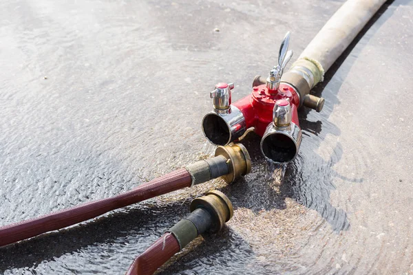 Close view of Fire Water hose connector on ground