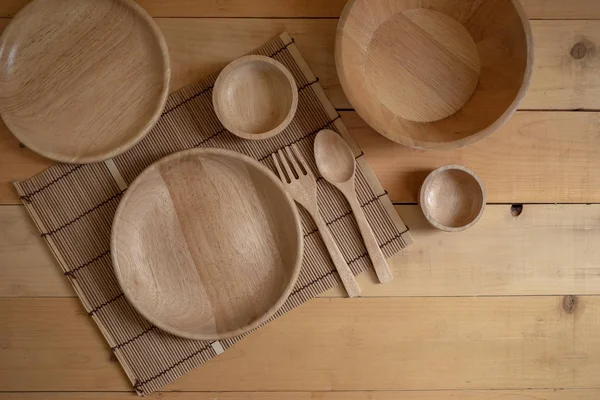 Wooden kitchenware on Natural pattern wood background. top view.