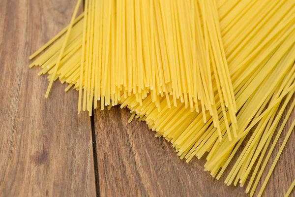 Yellow Long Spaghetti Rustic Wooden Background — Stock Photo, Image