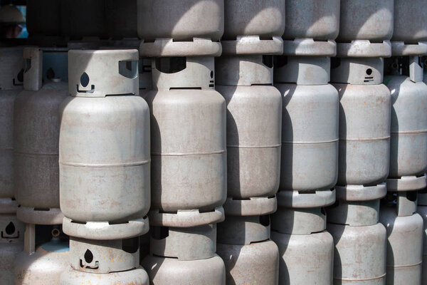 Stack of old Gas containers, gas tanks.