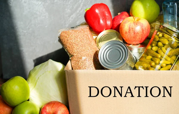 Donation Box Various Food Open Cardboard Box Butter Canned Goods — Stock Photo, Image