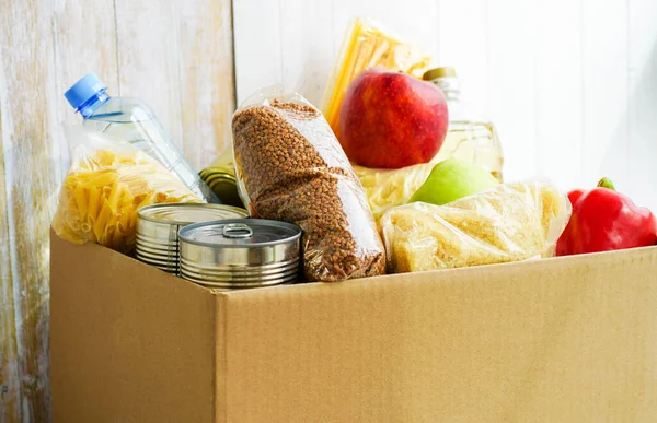 Donation Box Various Food Open Cardboard Box Butter Canned Goods — Stock Photo, Image