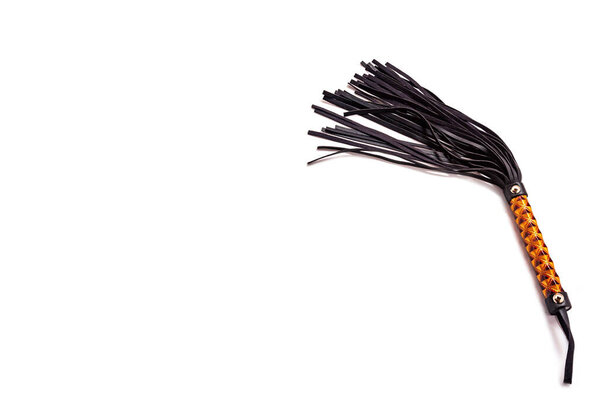 Whip on white background. Accessories for adult sexual games. Toys for BDSM, spanking devices. Spanking and punishment concept. This Whip is specially designed for couples in bedroom. 