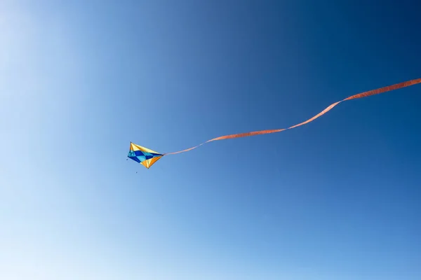 Colorful Kite Flying Red Ribbon Blue Sky — Stock Photo, Image