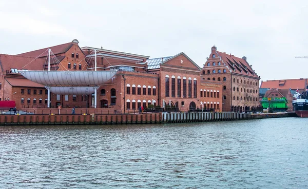 Polish Baltic Philharmonic and Hotel Krolewski on the Motlawa river on the island of Olowianka in Gdansk, Poland Stock Picture