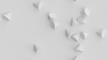 Beyaz külahlar düşüyor. Üç boyutlu ilkel geometrik şekiller sallanıyor. Gri arkaplanda dağınık nesneler.