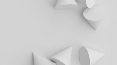 Beyaz külahlar düşüyor. Üç boyutlu ilkel geometrik şekiller sallanıyor. Gri arkaplanda dağınık nesneler.