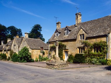 Cotswold cottages and the ancient cross, Stanton, Gloucestershire, Cotswolds, England, UK, Europe clipart