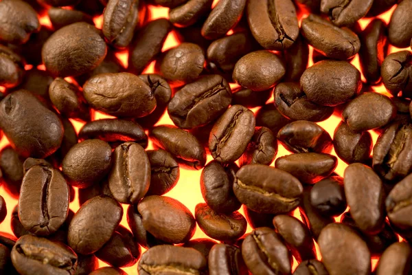 Świecące Podświetlane Ziarna Kawy Zbliżenie Tekstury — Zdjęcie stockowe