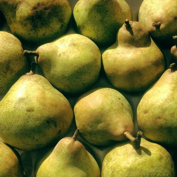 Close up market stall pears. Mobile phone photo with some phone or tablet post processing.