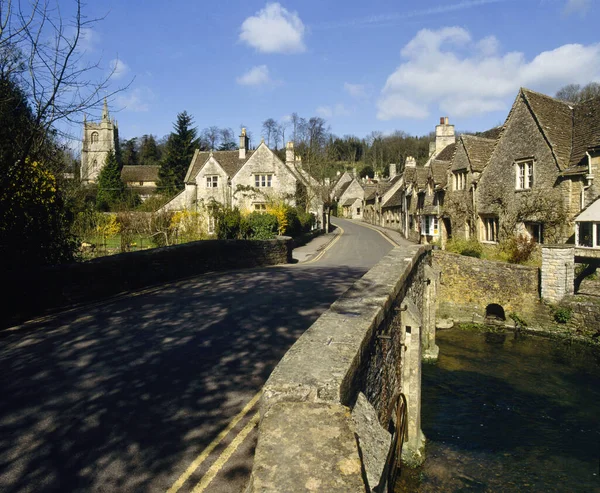 Picturesque cotswold stone cottages line the road, Castle Combe, Wiltshire, Cotswolds, England, UK, Europe