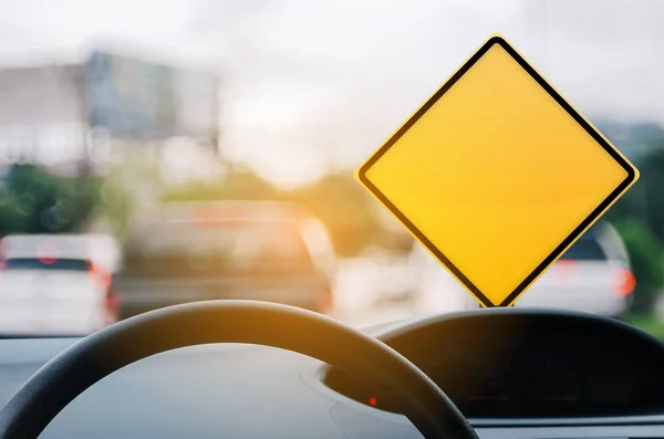 Empty Yellow Warning Sign Car View Steering Wheel Blur Traffic — Stock Photo, Image