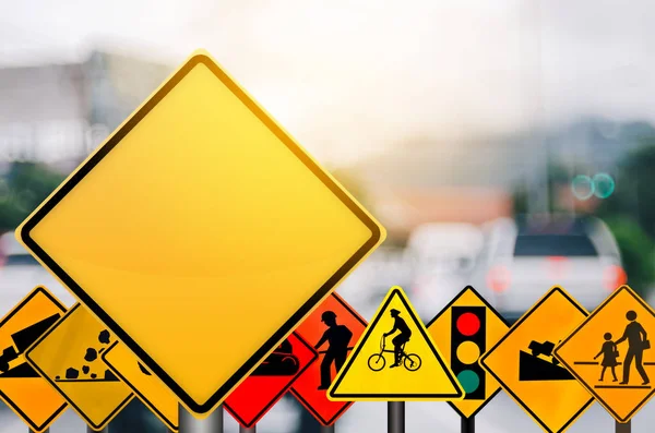 Empty yellow and set of traffic sign on blur traffic road with colorful bokeh city light abstract background. — Stock Photo, Image