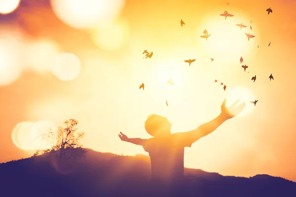 Copy space of man rise hand up on top of mountain and sunset sky abstract background. — Stock Photo, Image