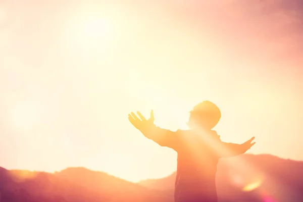 Copy space of man rise hand up on top of mountain and sunset sky abstract background. — Stock Photo, Image