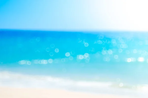 Blur tropical beach with bokeh sun light wave abstract background. — Stock Photo, Image