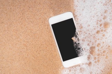 Kum plaj doku arka plan akıllı telefon.