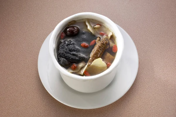 Chinese herbal soup served in a bowl