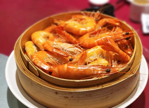 Fresh delicious shrimps on the traditional bamboo pan