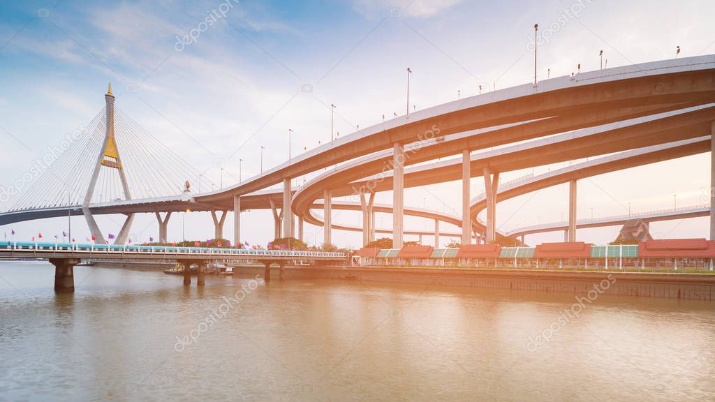 Highway intersection connect to suspension bridge river front 