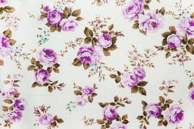 Mor vintage desen kumaş arka plan üzerinde yükseldi..