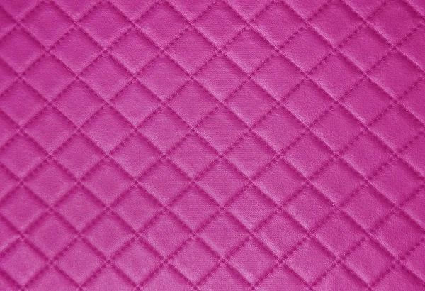 Roze lederen textuur met naad achtergrond — Stockfoto