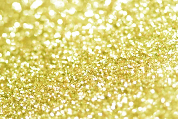 Gouden bokeh textuur. Feestelijke glitter achtergrond met intreepupil li — Stockfoto