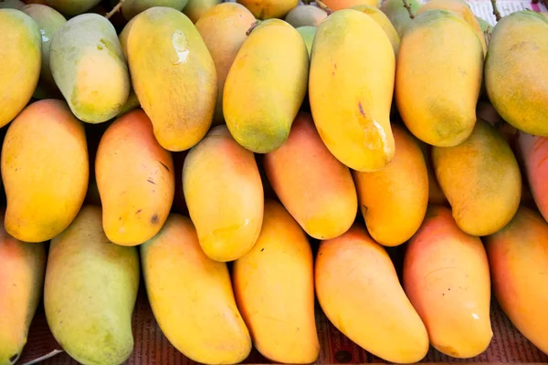 Mango fruits on the local market stand in Thailand