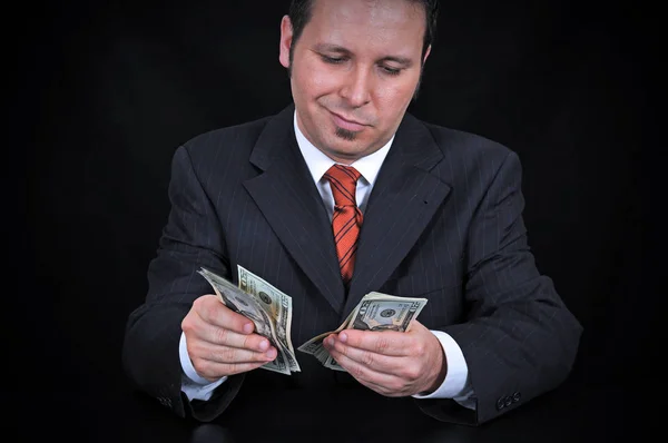 Бизнесмен Считает Деньги Черном Фоне — стоковое фото