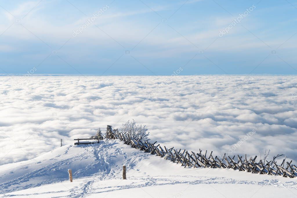 Above the clouds. View from the mountain of Riga, Switzerland. Meditation bench on top of a mountain.